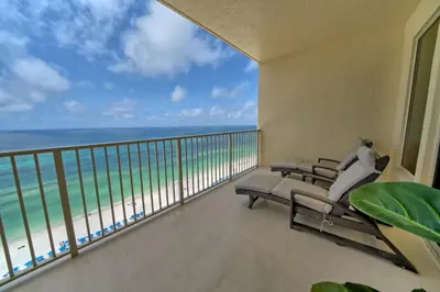 a balcony with chairs and a view of the ocean at Pleasant Oceanfront Condo with Large Balcony and Beach Access - Unit 1605 in Panama City Beach