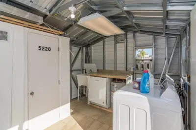 a kitchen with white cabinets and a counter top at Villa Serenity, Pet Friendly in Panama City Beach