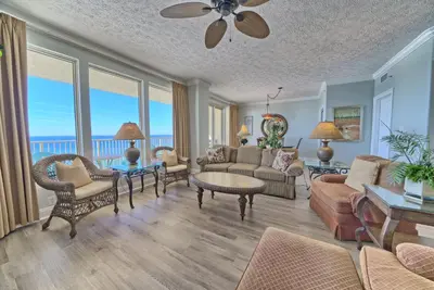 a living room with a couch and chairs at Tropical Gulf Front Condo with Picnic Area & Grills - Unit 0802 in Panama City Beach