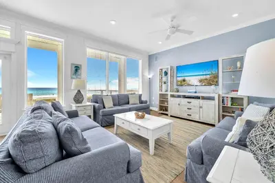 a living room with a couch and a tv at Fishers in Panama City Beach