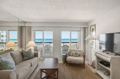 a living room with a couch and a television at Pinnacle Port C1-203 in Carillon Beach