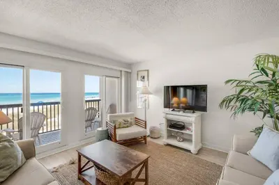 a living room with a view of the ocean at Pinnacle Port C1-203 in Carillon Beach