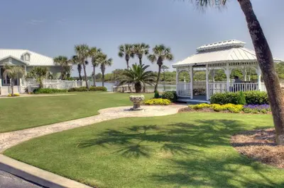 a park with a gazebo and palm trees at Pinnacle Port C1-203 in Carillon Beach