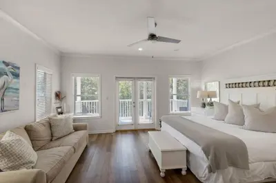a large bedroom with a large bed and a couch at Seabreeze Cottage #45 in Watersound Beach
