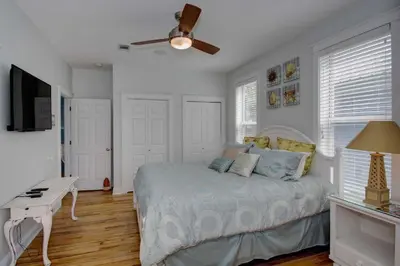 a bedroom with a bed and a ceiling fan at 2 Blessed 2 Be Stressed in Watersound Beach