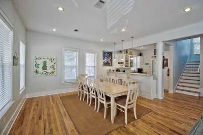 a dining room and kitchen with a table and chairs at 2 Blessed 2 Be Stressed in Watersound Beach