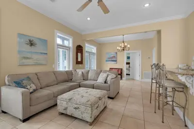 a living room with a couch and a table at Grace Villa in Watersound Beach