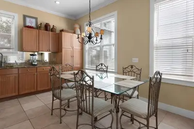 a kitchen with a dining room table and chairs at Grace Villa in Watersound Beach