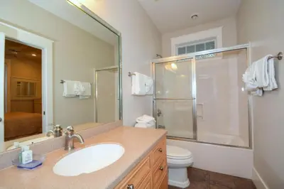 a bathroom with a sink and a shower and a toilet at Beach Breeze in Watersound Beach