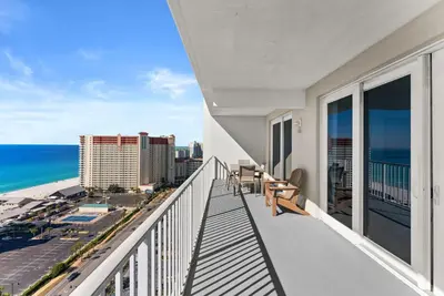 a balcony with a view of the ocean at Laketown Wharf Remodeled Gulf View Retreat! 3BR Resort Condo with Huge Balcony in Panama City Beach