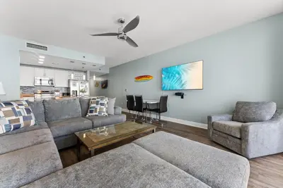 a living room with a couch and two chairs and a table at Laketown Wharf Remodeled Gulf View Retreat! 3BR Resort Condo with Huge Balcony in Panama City Beach