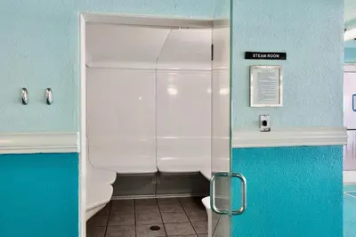 a bathroom with a shower with a toilet in it at Ocean Reef Beach Resort! Beach Front! Free Seasonal Beach Chairs! by Dolce Vita Getaways PCB in Panama City Beach