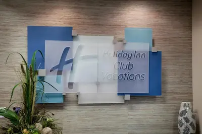 a wall with blue and white signs on it at Holiday Inn Club Vacations Panama City Beach Resort in Panama City Beach