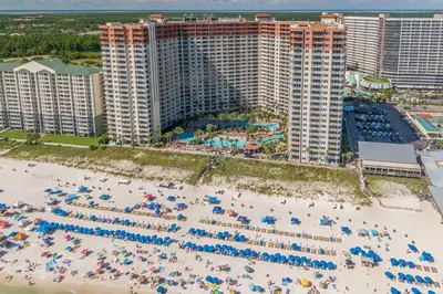 an aerial view of a beach with chairs and umbrellas at Shores of Panama Condo With Same Level Parking in Panama City Beach