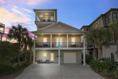 a large house with a balcony on top of it at Seas the Day in Seagrove Beach