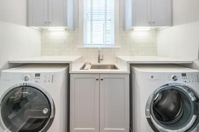 a kitchen with a washing machine and a sink at The Nautilus in Watersound Beach