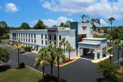 a rendering of a white building with a parking lot at Hampton Inn by Hilton Panama City Beach in Panama City Beach