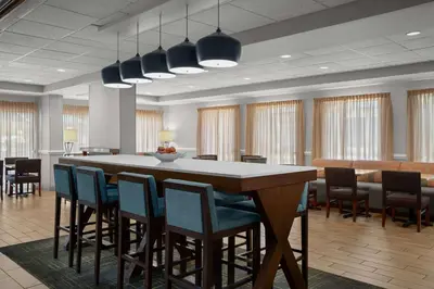 a conference room with a large table and chairs at Hampton Inn by Hilton Panama City Beach in Panama City Beach