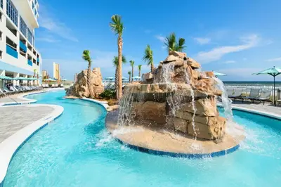 a pool at a resort with a water slide at SpringHill Suites by Marriott Panama City Beach Beachfront in Panama City Beach