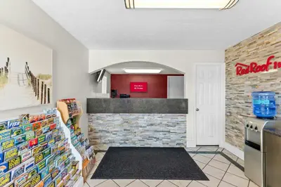 a kitchen with a brick wall and a counter at Red Roof Inn Panama City Beach in Panama City Beach
