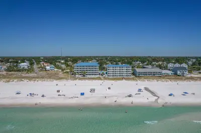 an aerial view of a beach with people and the ocean at Sugar Sands Beachfront Hotel, a By The Sea Resort in Panama City Beach