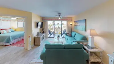 a living room with a couch and a bed at Summer House 101 A in Panama City Beach