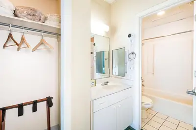 a bathroom with a sink and a toilet at Landmark Holiday Beach in Panama City Beach