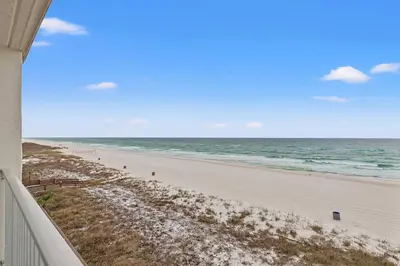 a view of the beach from the balcony of a beach house at The Reef At Seahaven Beach Resorts in Panama City Beach