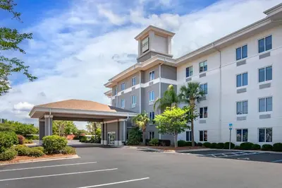 a rendering of the front of a hotel with a clock tower at Garner Hotel Panama City Beach Northeast by IHG in Panama City Beach