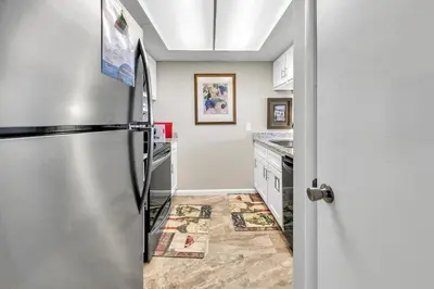 a kitchen with a stainless steel refrigerator at Windward 604 at Edgewater in Panama City Beach