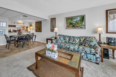 a living room with a couch and a table at Windward 604 at Edgewater in Panama City Beach