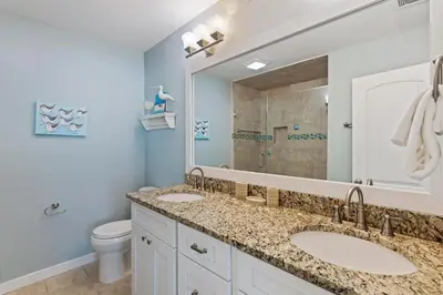 a bathroom with two sinks and a toilet at Walton Dunes 2 in Santa Rosa Beach