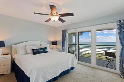 a bedroom with a bed and a ceiling fan at Walton Dunes 2 in Santa Rosa Beach