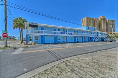 a blue building on the corner of a street at Aqua View Motel in Panama City Beach