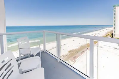 a balcony with chairs and a view of the beach at Hampton Inn & Suites Panama City Beach-Beachfront in Panama City Beach