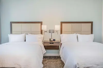 two beds sitting next to each other in a bedroom at Hampton Inn & Suites Panama City Beach-Beachfront in Panama City Beach