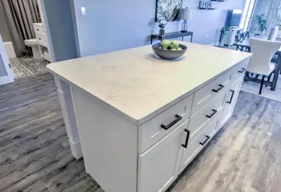 a kitchen island with a bowl of fruit on it at Regency Towers - beachfront condo in Panama City Beach