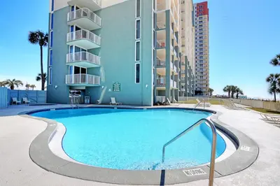 a large swimming pool in front of a building at Long Beach Resort 204 in Panama City Beach