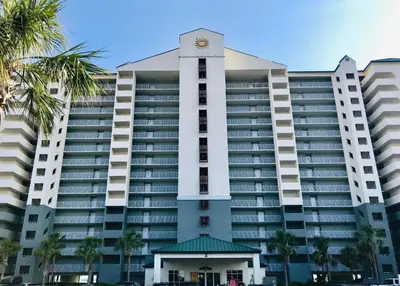 a large building with a clock tower in front of it at Long Beach Resort 204 in Panama City Beach