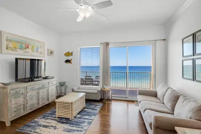 a living room with a couch and a television at Treasure Island 0510 in Panama City Beach