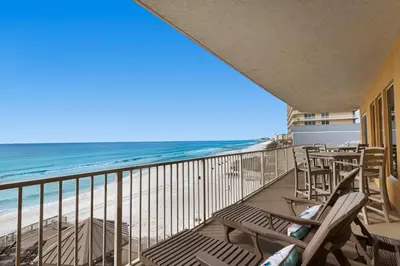 a balcony with chairs and a view of the beach at Treasure Island 0412 in Panama City Beach