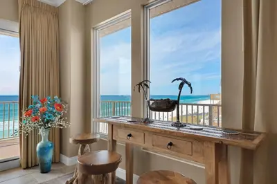 a room with a table and a large window at Treasure Island 0412 in Panama City Beach