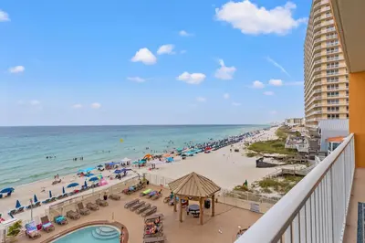 a view of a beach with people and the ocean at Treasure Island 0411 in Panama City Beach