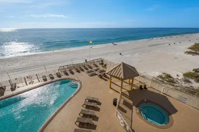 an overhead view of a beach with a pool and chairs at Treasure Island 0411 in Panama City Beach