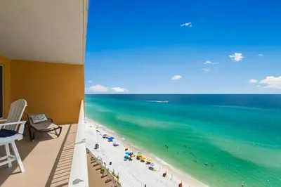 a view of the beach from the balcony of a hotel at Treasure Island 0906 in Panama City Beach