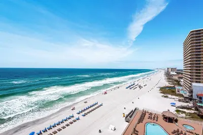 an overhead view of a beach with people and the ocean at Treasure Island 0906 in Panama City Beach