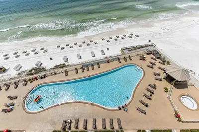 an overhead view of a swimming pool and the beach at Treasure Island 0810 in Panama City Beach