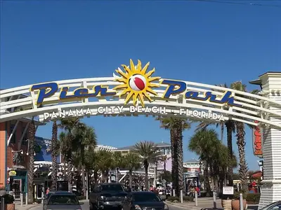 a sign over a street in a city with cars at Splash 1505E in Panama City Beach