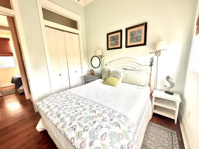 a bedroom with a bed with a white bedspread at Saltwater Gospel in Inlet Beach