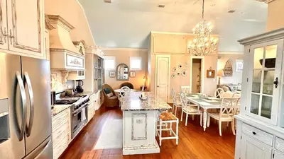 a kitchen with a table and a dining room at Saltwater Gospel in Inlet Beach